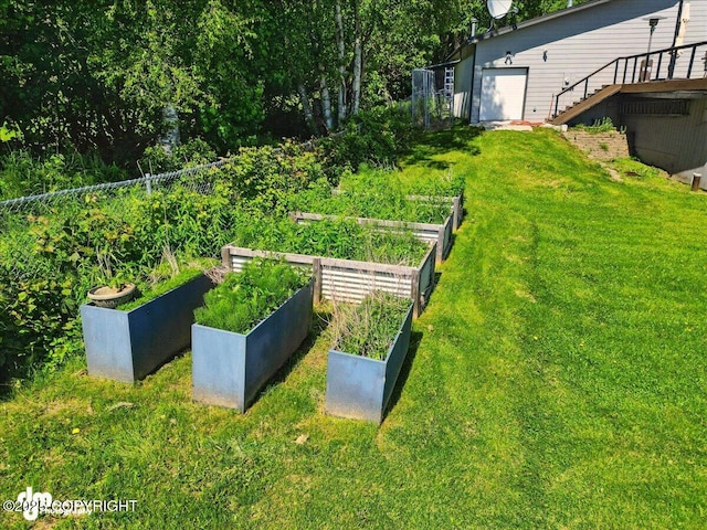5100 W Lakeside Dr, Wasilla, AK 99654 - view of yard with a vegetable garden, stairs, and a wooden deck