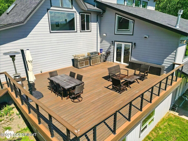 5100 W Lakeside Dr, Wasilla, AK 99654 - deck with a grill, outdoor dining area, and french doors