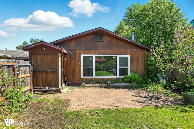 3401 Lois Dr, Anchorage, AK 99517 - view of front of home with a patio