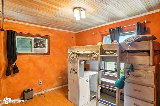 3401 Lois Dr, Anchorage, AK 99517 - bedroom with wood finished floors, a baseboard heating unit, ornamental molding, and wood ceiling