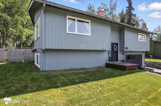 13481 Baywind Dr, Anchorage, AK 99516 - split foyer home with a garage and a chimney