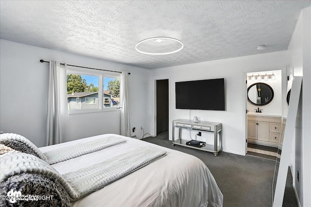 13481 Baywind Dr, Anchorage, AK 99516 - bedroom with dark colored carpet, a textured ceiling, and connected bathroom