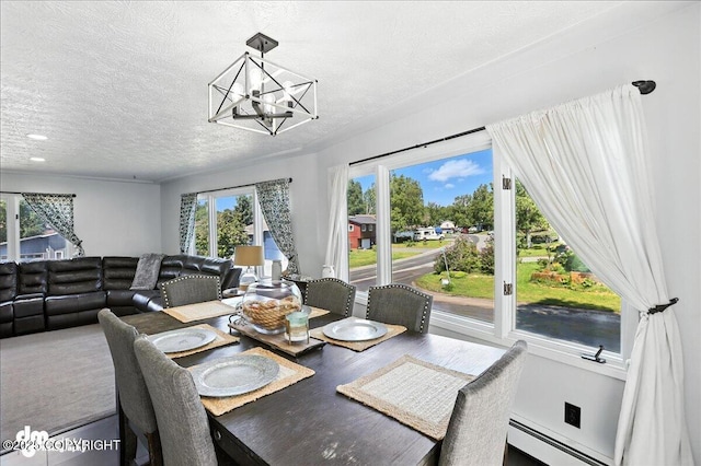 13481 Baywind Dr, Anchorage, AK 99516 - dining area featuring a chandelier, a textured ceiling, baseboard heating, and recessed lighting