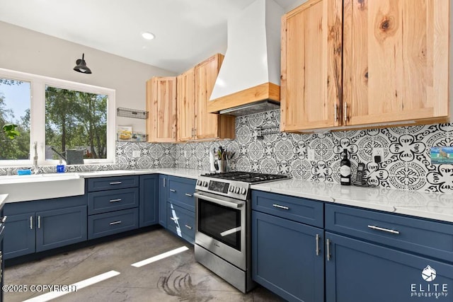 4722 S Gon Fishin Dr, Wasilla, AK 99623 - kitchen featuring gas stove, custom range hood, blue cabinets, decorative backsplash, and light brown cabinets
