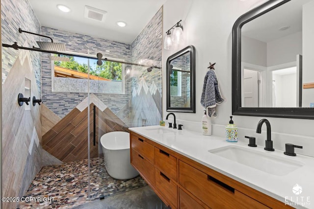 4722 S Gon Fishin Dr, Wasilla, AK 99623 - full bath with tile walls, a freestanding tub, a shower stall, and double vanity