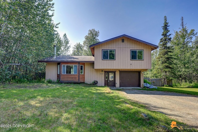 3150 E Escondido Ave, Wasilla, AK 99654 - split level home featuring a garage and dirt driveway