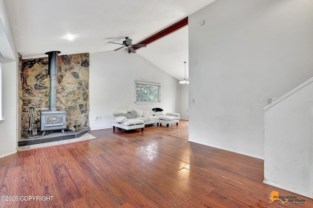 3150 E Escondido Ave, Wasilla, AK 99654 - living area featuring ceiling fan, wood finished floors, and a wood stove