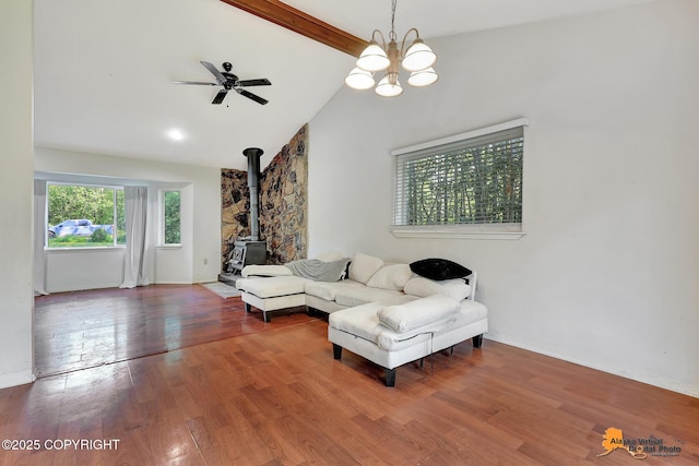 3150 E Escondido Ave, Wasilla, AK 99654 - living room with a wood stove, wood finished floors, a ceiling fan, and a chandelier
