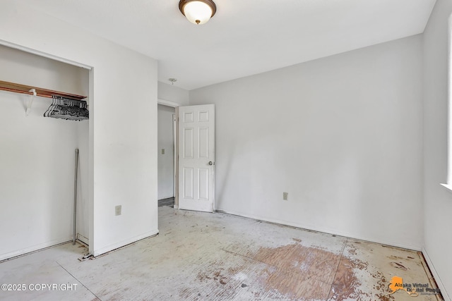 3150 E Escondido Ave, Wasilla, AK 99654 - unfurnished bedroom featuring a closet and baseboards