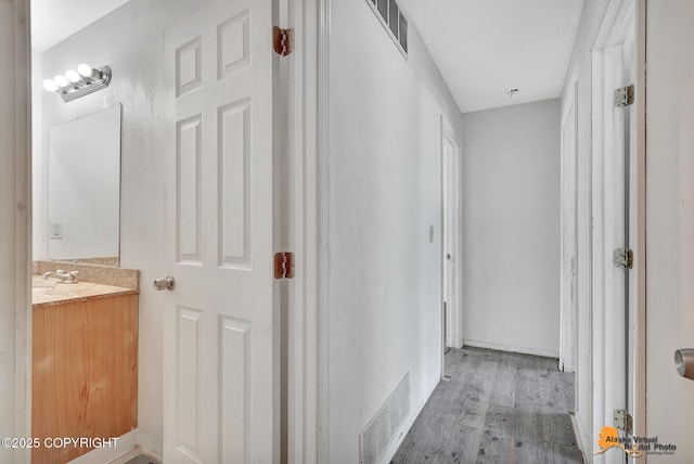 3150 E Escondido Ave, Wasilla, AK 99654 - hallway featuring light wood-style flooring