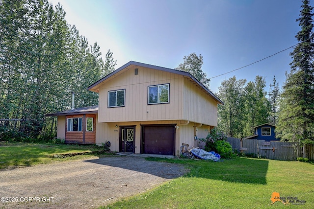 3150 E Escondido Ave, Wasilla, AK 99654 - tri-level home featuring driveway and an attached garage