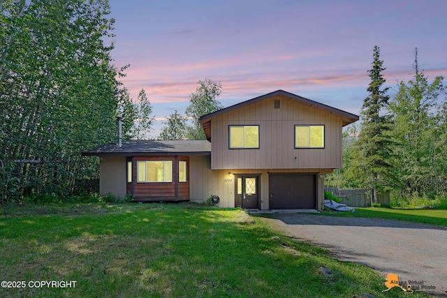 3150 E Escondido Ave, Wasilla, AK 99654 - split level home featuring an attached garage and driveway