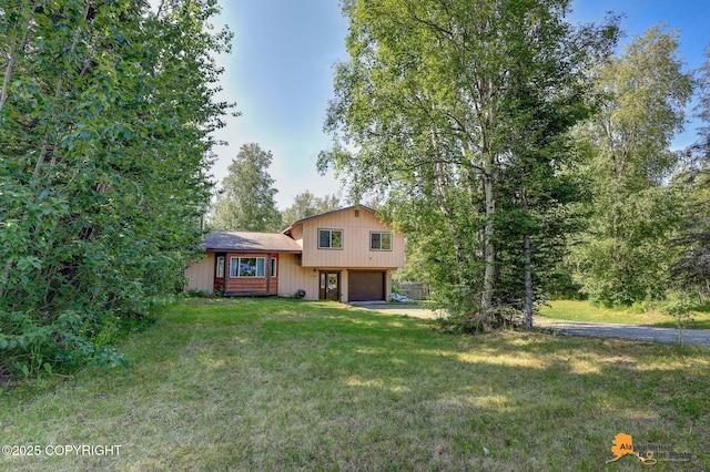3150 E Escondido Ave, Wasilla, AK 99654 - split level home with a garage and a front lawn