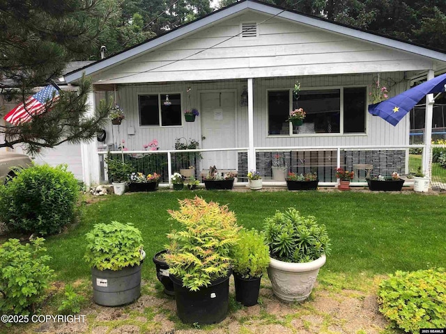4128 Taku Blvd, Juneau, AK 99801 - view of front facade featuring a porch and a front lawn