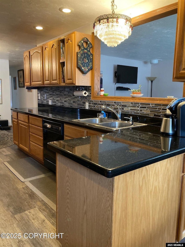 4128 Taku Blvd, Juneau, AK 99801 - kitchen featuring black dishwasher, wood finished floors, decorative backsplash, a chandelier, and recessed lighting