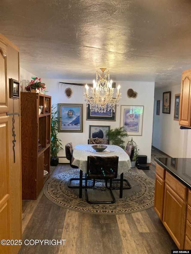 4128 Taku Blvd, Juneau, AK 99801 - dining space featuring a chandelier, dark wood-style flooring, and baseboard heating