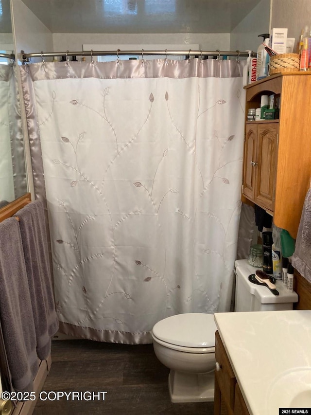 4128 Taku Blvd, Juneau, AK 99801 - full bath with wood finished floors, vanity, and a shower with curtain
