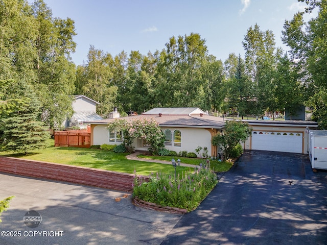 14121 Sunview Dr, Anchorage, AK 99515 - ranch-style house with driveway, an attached garage, stucco siding, and a chimney