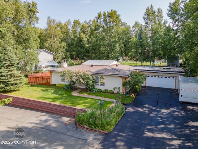 14121 Sunview Dr, Anchorage, AK 99515 - view of front facade featuring driveway, a front yard, stucco siding, an attached garage, and a chimney