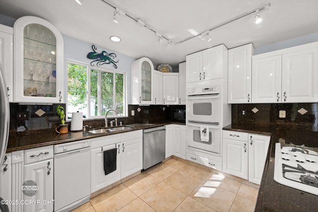 14121 Sunview Dr, Anchorage, AK 99515 - kitchen with white appliances, white cabinets, tasteful backsplash, and light tile patterned floors