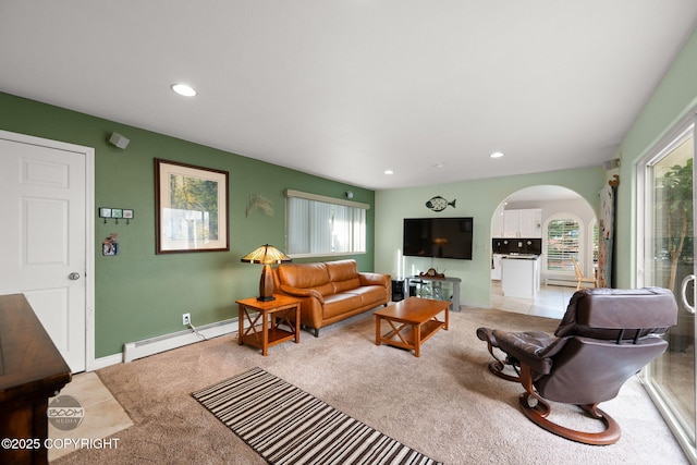 14121 Sunview Dr, Anchorage, AK 99515 - living area featuring a baseboard radiator, arched walkways, healthy amount of natural light, and recessed lighting
