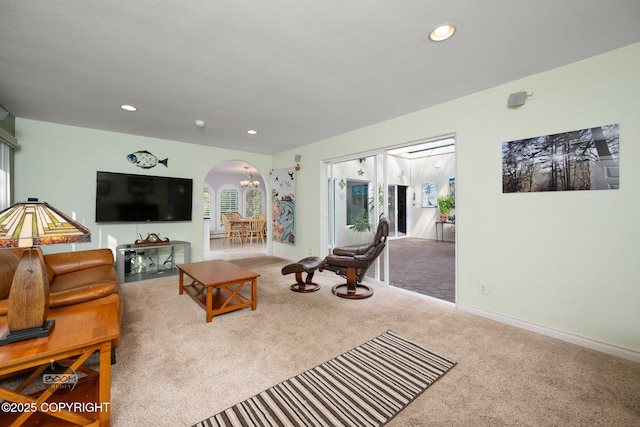 14121 Sunview Dr, Anchorage, AK 99515 - living area with arched walkways, carpet floors, and recessed lighting