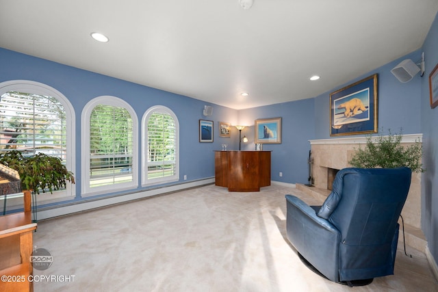 14121 Sunview Dr, Anchorage, AK 99515 - living area with carpet flooring, a premium fireplace, recessed lighting, and a baseboard radiator