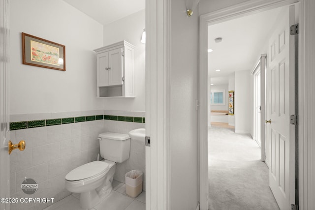 14121 Sunview Dr, Anchorage, AK 99515 - half bathroom with tile walls and a wainscoted wall