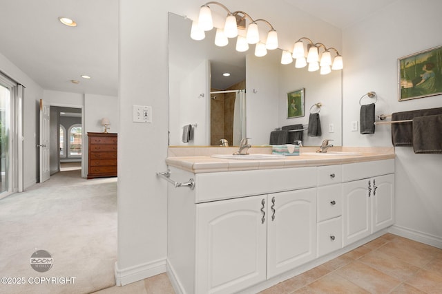 14121 Sunview Dr, Anchorage, AK 99515 - full bathroom with double vanity, a shower, and recessed lighting