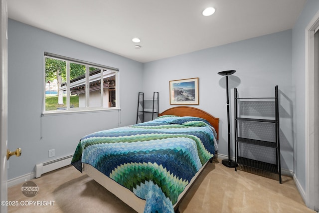 14121 Sunview Dr, Anchorage, AK 99515 - carpeted bedroom featuring a baseboard heating unit and recessed lighting