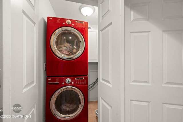 14121 Sunview Dr, Anchorage, AK 99515 - laundry room featuring stacked washing machine and dryer and tile patterned flooring