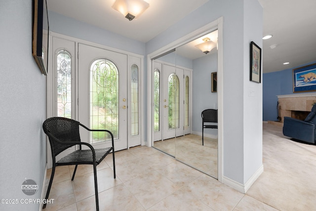 14121 Sunview Dr, Anchorage, AK 99515 - foyer with a tile fireplace and light tile patterned floors