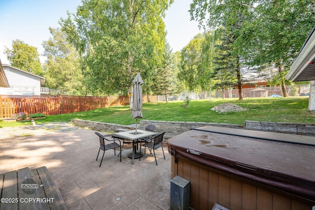 14121 Sunview Dr, Anchorage, AK 99515 - fenced backyard with a hot tub, a patio, and outdoor dining area