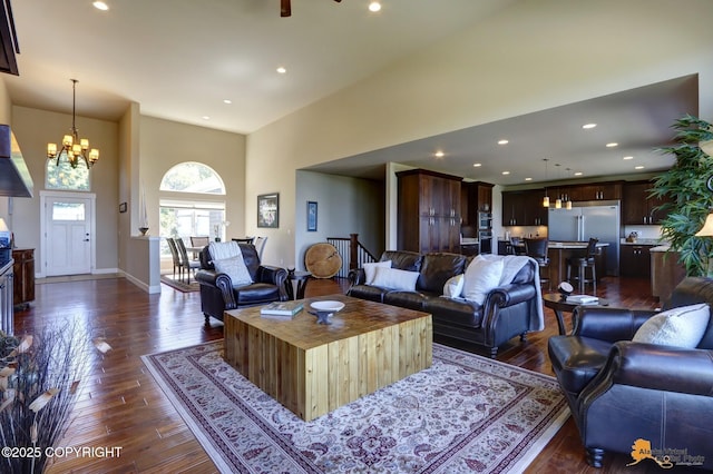 16071 Mountain Air Dr, Anchorage, AK 99516 - living room with dark wood-type flooring, a high ceiling, recessed lighting, and a chandelier