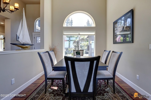 16071 Mountain Air Dr, Anchorage, AK 99516 - dining space with a chandelier, a high ceiling, and dark wood finished floors