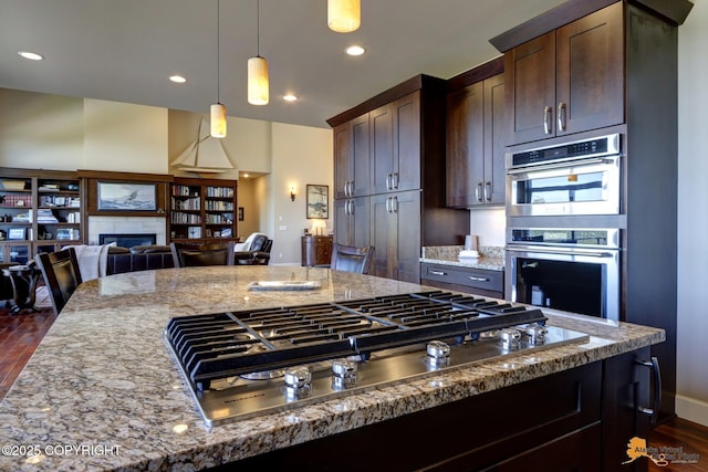 16071 Mountain Air Dr, Anchorage, AK 99516 - kitchen with appliances with stainless steel finishes, dark wood-type flooring, open floor plan, light stone countertops, and recessed lighting