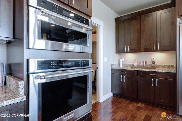 16071 Mountain Air Dr, Anchorage, AK 99516 - kitchen featuring oven, dark wood finished floors, and dark brown cabinets