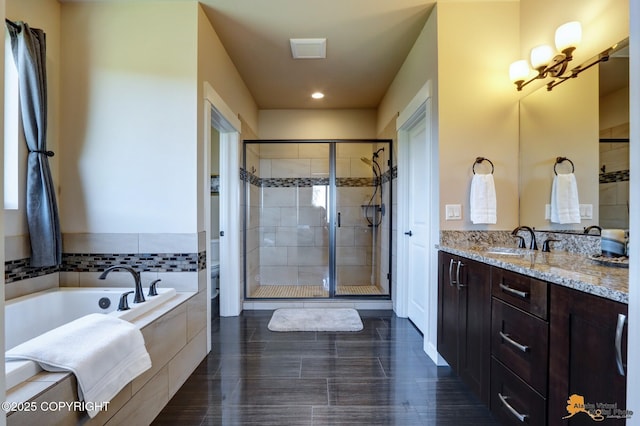 16071 Mountain Air Dr, Anchorage, AK 99516 - bathroom featuring a garden tub, vanity, a shower stall, and recessed lighting