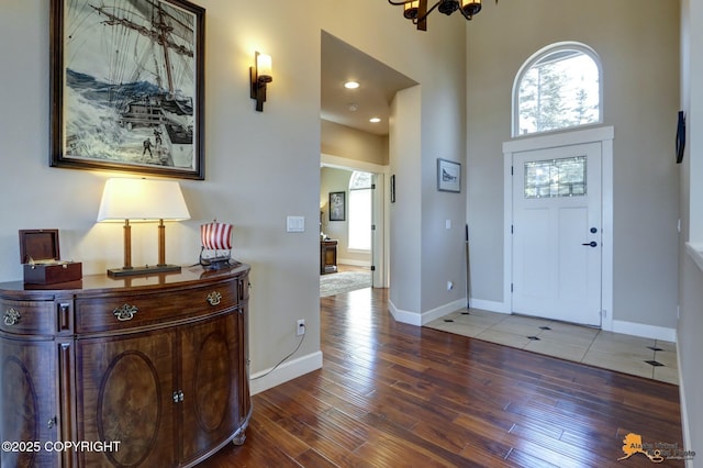 16071 Mountain Air Dr, Anchorage, AK 99516 - foyer featuring plenty of natural light, wood-type flooring, and a towering ceiling