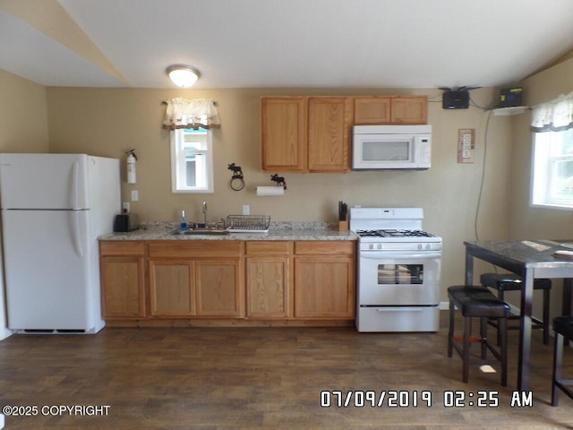 46210 Bonita Ave, Soldotna, AK 99669 - kitchen featuring white appliances, dark wood finished floors, and light stone counters