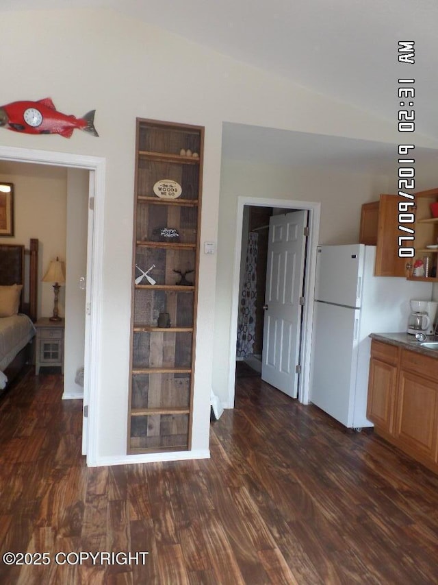 46210 Bonita Ave, Soldotna, AK 99669 - dining room featuring dark wood finished floors and vaulted ceiling