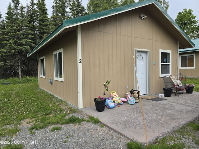 46210 Bonita Ave, Soldotna, AK 99669 - back of house featuring a patio and a metal roof
