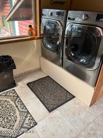53245 Coyote Ln, Nikiski/North Kenai, AK 99611 - laundry area featuring washer and dryer and tile patterned flooring