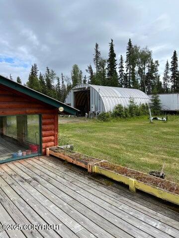 53245 Coyote Ln, Nikiski/North Kenai, AK 99611 - wooden terrace with a lawn and an outbuilding