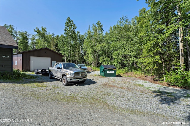 19712 Chugach Park Dr, Eagle River, AK 99567 - view of vehicle parking featuring a detached garage and driveway