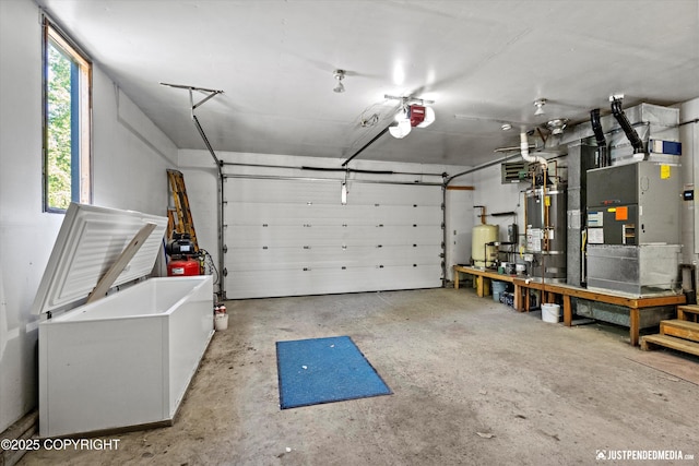 19712 Chugach Park Dr, Eagle River, AK 99567 - garage with water heater, a garage door opener, and heating unit