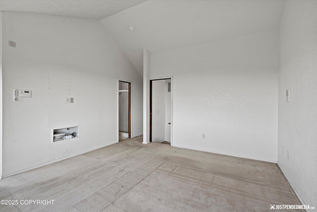 19712 Chugach Park Dr, Eagle River, AK 99567 - empty room with vaulted ceiling and carpet floors