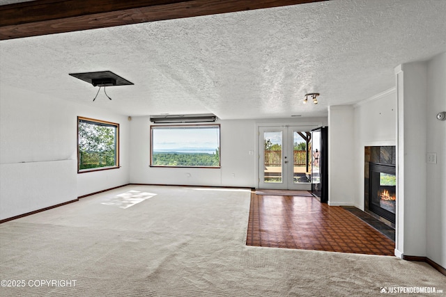 19712 Chugach Park Dr, Eagle River, AK 99567 - unfurnished living room featuring carpet floors, a tiled fireplace, and a textured ceiling