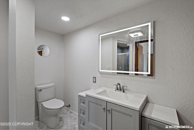 19712 Chugach Park Dr, Eagle River, AK 99567 - full bathroom with vanity, a textured wall, and an enclosed shower