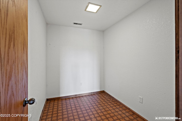19712 Chugach Park Dr, Eagle River, AK 99567 - empty room with tile patterned floors and baseboards